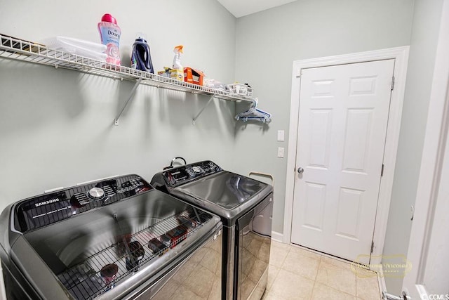 4499 Firethorne Dr, Murrells Inlet, SC 29576 - laundry area with washer and clothes dryer and light tile patterned flooring