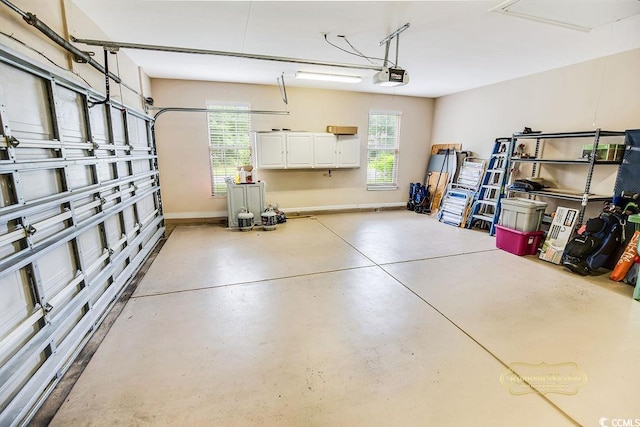 4499 Firethorne Dr, Murrells Inlet, SC 29576 - garage featuring a garage door opener and baseboards