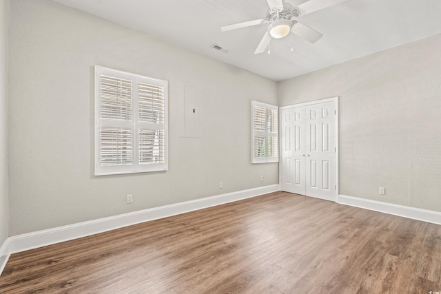 3597 Sunfish St, Murrells Inlet, SC 29576 - unfurnished bedroom featuring wood finished floors, a closet, and ceiling fan