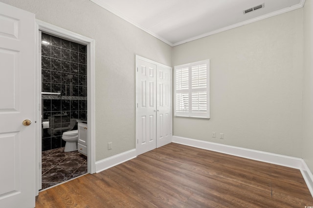 3597 Sunfish St, Murrells Inlet, SC 29576 - unfurnished bedroom featuring ornamental molding, wood finished floors, ensuite bathroom, and a closet