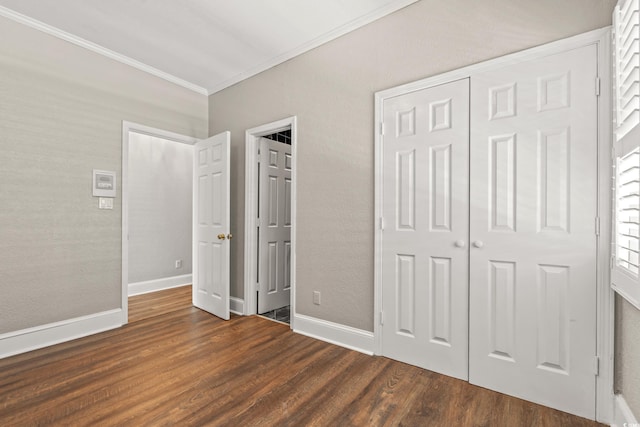 3597 Sunfish St, Murrells Inlet, SC 29576 - unfurnished bedroom with ornamental molding, dark wood finished floors, and a closet