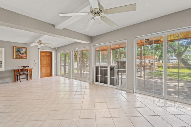 3597 Sunfish St, Murrells Inlet, SC 29576 - unfurnished room featuring beam ceiling, ceiling fan, light tile patterned floors, healthy amount of natural light, and a textured ceiling