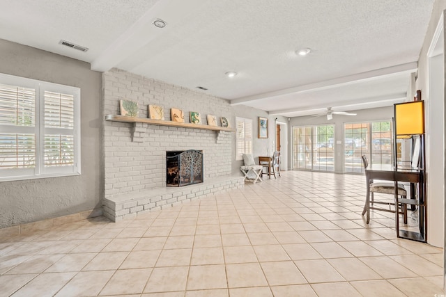 3597 Sunfish St, Murrells Inlet, SC 29576 - unfurnished living room featuring beamed ceiling, a textured ceiling, a brick fireplace, light tile patterned floors, and a ceiling fan