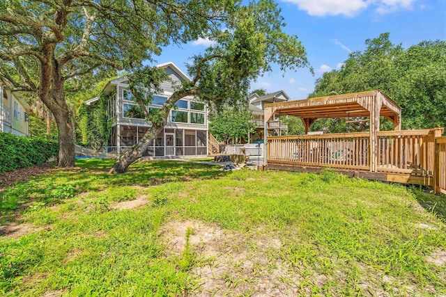 3597 Sunfish St, Murrells Inlet, SC 29576 - view of grassy yard featuring a sunroom and a deck
