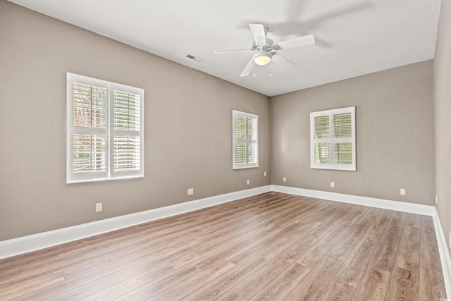 3597 Sunfish St, Murrells Inlet, SC 29576 - empty room featuring plenty of natural light, light wood-style floors, and ceiling fan