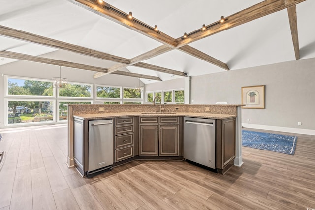 3597 Sunfish St, Murrells Inlet, SC 29576 - kitchen with stainless steel dishwasher, light wood-style flooring, light stone counters, and a kitchen island with sink