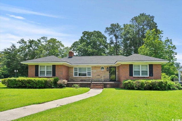 1008 N Withlacoochee Ave, Marion, SC 29571 - ranch-style house featuring a front lawn, a porch, a chimney, and brick siding
