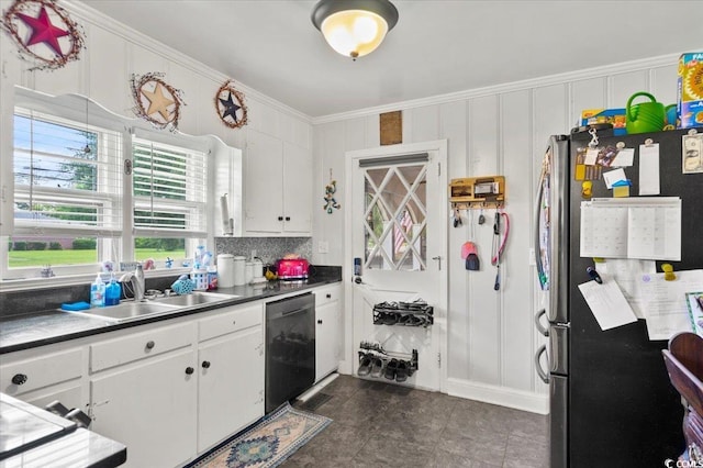 1008 N Withlacoochee Ave, Marion, SC 29571 - kitchen with appliances with stainless steel finishes, crown molding, white cabinetry, dark countertops, and dark tile patterned floors