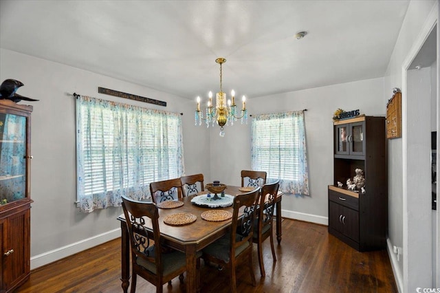 1008 N Withlacoochee Ave, Marion, SC 29571 - dining space with dark wood-style floors and a chandelier