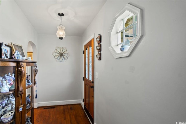 1008 N Withlacoochee Ave, Marion, SC 29571 - hallway featuring wood finished floors, arched walkways, and plenty of natural light