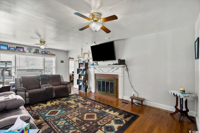 1008 N Withlacoochee Ave, Marion, SC 29571 - living room featuring ceiling fan, wood finished floors, and a brick fireplace