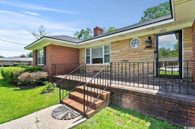 1008 N Withlacoochee Ave, Marion, SC 29571 - property entrance featuring a lawn, a chimney, and stone siding
