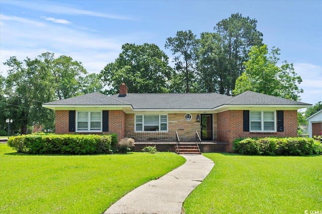 1008 N Withlacoochee Ave, Marion, SC 29571 - ranch-style home featuring a front lawn, a chimney, and brick siding
