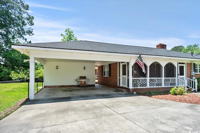 1008 N Withlacoochee Ave, Marion, SC 29571 - ranch-style home with brick siding, driveway, a chimney, an attached carport, and covered porch
