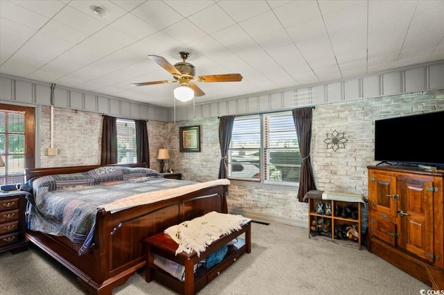 1008 N Withlacoochee Ave, Marion, SC 29571 - carpeted bedroom with brick wall and ceiling fan