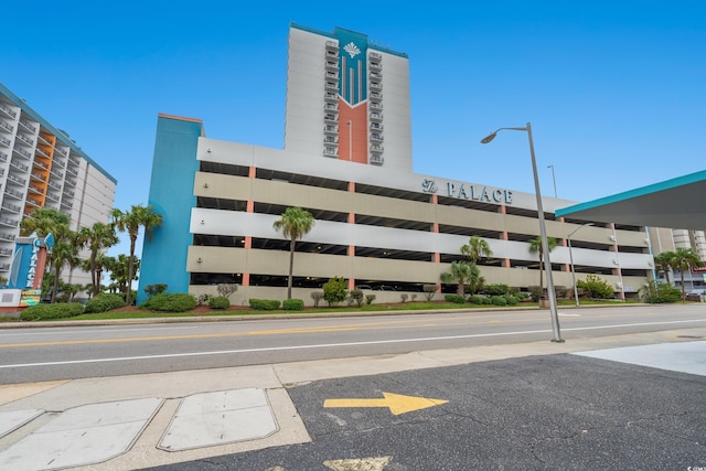 1605 S Ocean Blvd Unit 1403, Myrtle Beach, SC 29577 - view of apartment building / complex featuring uncovered parking
