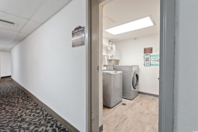 1605 S Ocean Blvd Unit 1403, Myrtle Beach, SC 29577 - laundry room with washer and dryer and baseboards
