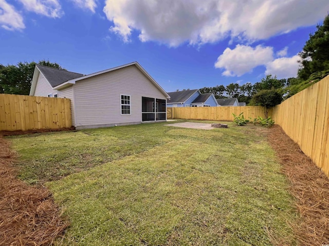9888 Conifer Ln, Murrells Inlet, SC 29576 - fenced backyard with a sunroom and a patio area