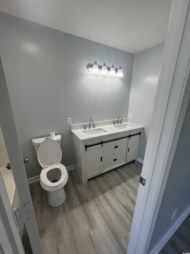 9888 Conifer Ln, Murrells Inlet, SC 29576 - bathroom featuring wood finished floors and double vanity