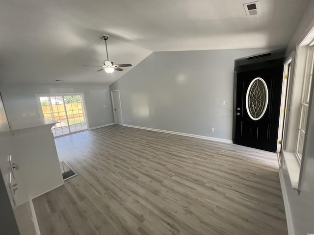 9888 Conifer Ln, Murrells Inlet, SC 29576 - unfurnished living room with a ceiling fan, lofted ceiling, and light wood-type flooring