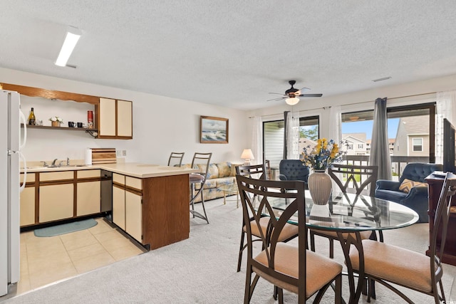 500 Fairway Village Dr Unit J-7, Myrtle Beach, SC 29588 - dining space featuring a textured ceiling, ceiling fan, and light carpet