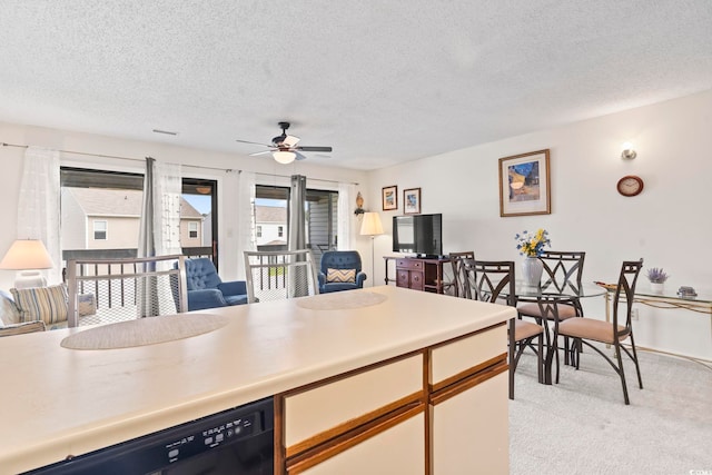 500 Fairway Village Dr Unit J-7, Myrtle Beach, SC 29588 - kitchen with open floor plan, a textured ceiling, black dishwasher, light colored carpet, and ceiling fan