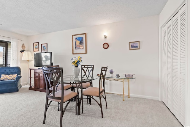 500 Fairway Village Dr Unit J-7, Myrtle Beach, SC 29588 - dining space featuring carpet floors and a textured ceiling