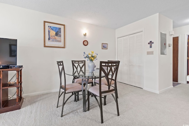 500 Fairway Village Dr Unit J-7, Myrtle Beach, SC 29588 - dining space featuring light carpet, electric panel, and a textured ceiling