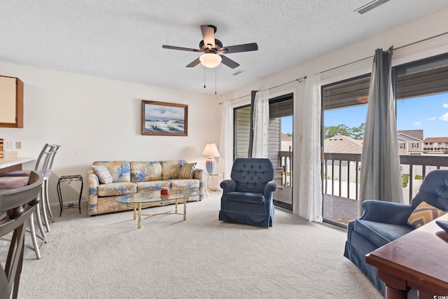 500 Fairway Village Dr Unit J-7, Myrtle Beach, SC 29588 - living area with light carpet, a ceiling fan, and a textured ceiling