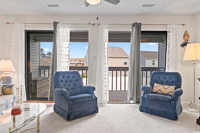 500 Fairway Village Dr Unit J-7, Myrtle Beach, SC 29588 - living area with carpet floors, ceiling fan, and a textured ceiling