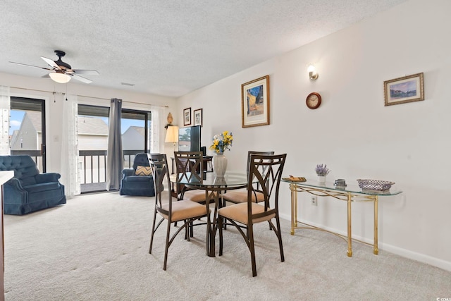 500 Fairway Village Dr Unit J-7, Myrtle Beach, SC 29588 - dining room with light colored carpet, a textured ceiling, and ceiling fan