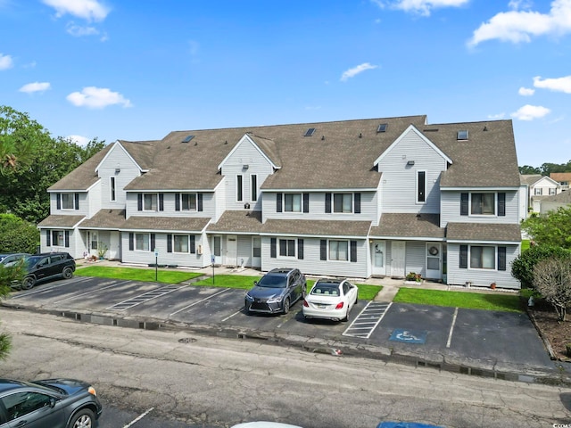 500 Fairway Village Dr Unit J-7, Myrtle Beach, SC 29588 - view of front of house with uncovered parking, a residential view, and roof with shingles