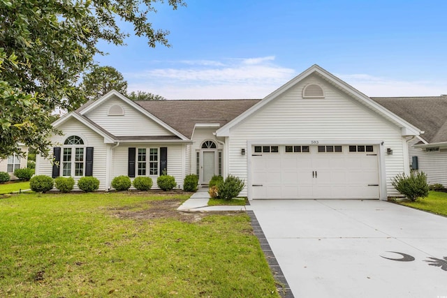 583 Wildflower Trl, Myrtle Beach, SC 29579 - view of front of property with a garage, concrete driveway, and a front yard