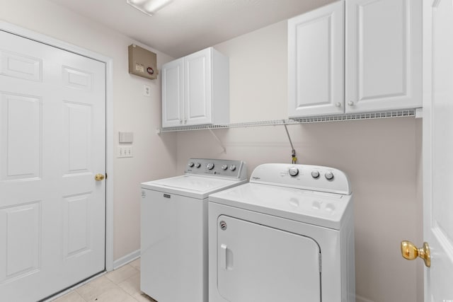 583 Wildflower Trl, Myrtle Beach, SC 29579 - washroom featuring cabinet space, washer and dryer, and light tile patterned floors