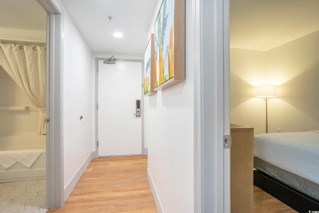 3000 N Ocean Blvd Unit 209, Myrtle Beach, SC 29577 - corridor with light wood-style flooring and recessed lighting