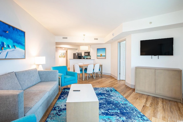 3000 N Ocean Blvd Unit 209, Myrtle Beach, SC 29577 - living area featuring light wood-style floors and baseboards