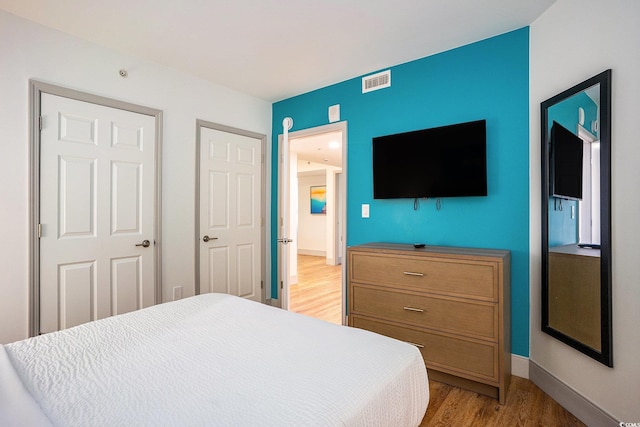 3000 N Ocean Blvd Unit 209, Myrtle Beach, SC 29577 - bedroom with light wood-style floors and baseboards
