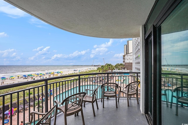 3000 N Ocean Blvd Unit 209, Myrtle Beach, SC 29577 - balcony with view of water and beach and view of pool