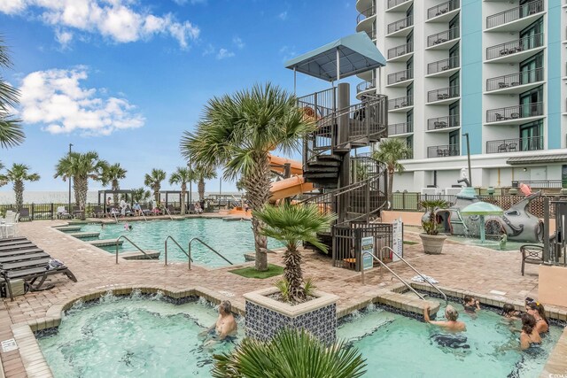 3000 N Ocean Blvd Unit 209, Myrtle Beach, SC 29577 - community pool featuring a hot tub and a patio area