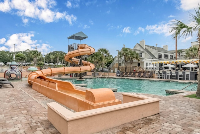 3000 N Ocean Blvd Unit 209, Myrtle Beach, SC 29577 - community pool featuring a water slide and a patio