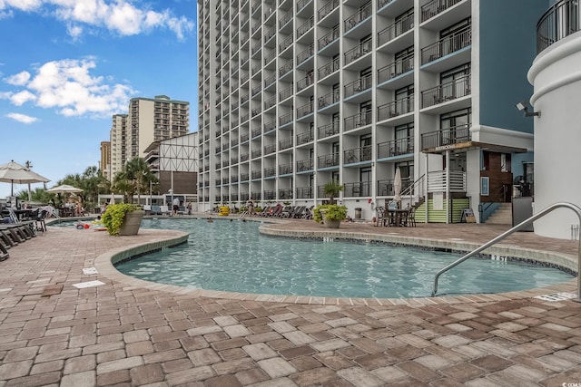 3000 N Ocean Blvd Unit 209, Myrtle Beach, SC 29577 - community pool featuring a patio