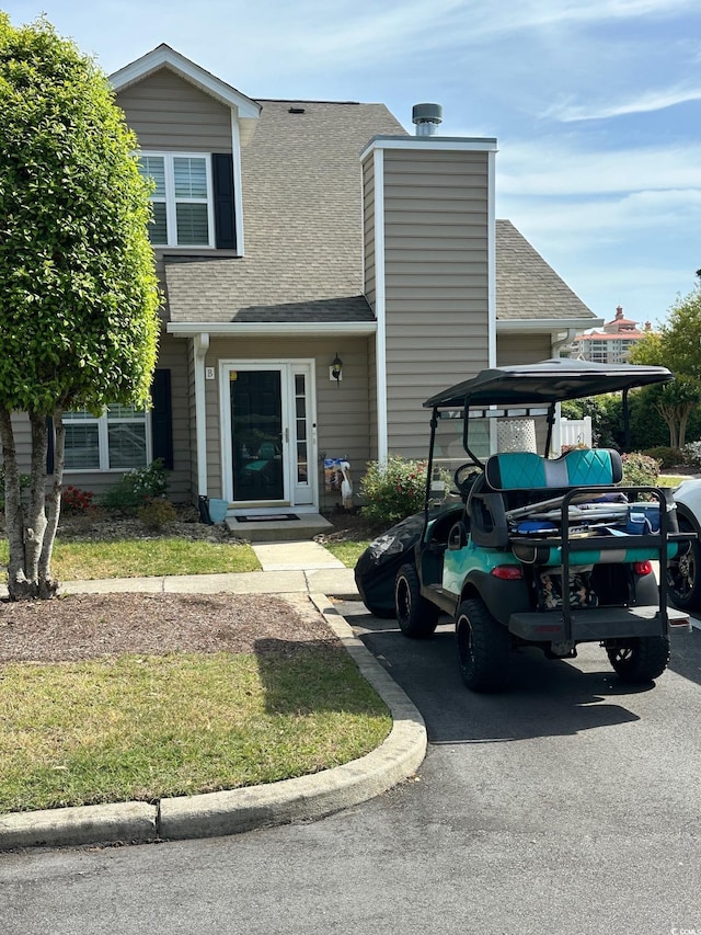 503 20th Ave N Unit 3B, North Myrtle Beach, SC 29582 - view of front facade featuring roof with shingles