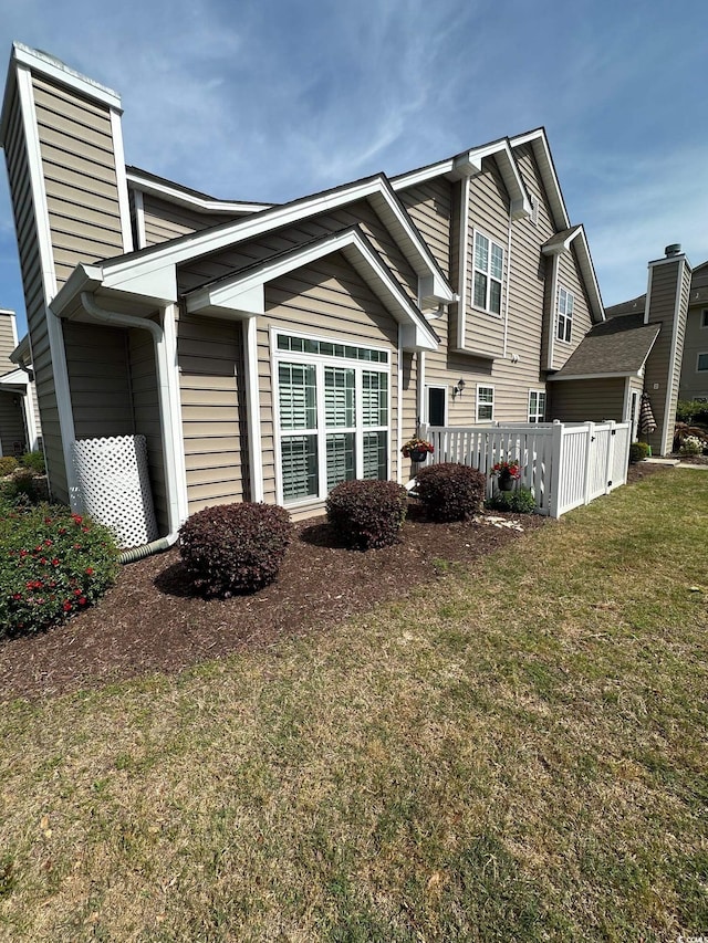 503 20th Ave N Unit 3B, North Myrtle Beach, SC 29582 - view of home's exterior featuring a lawn