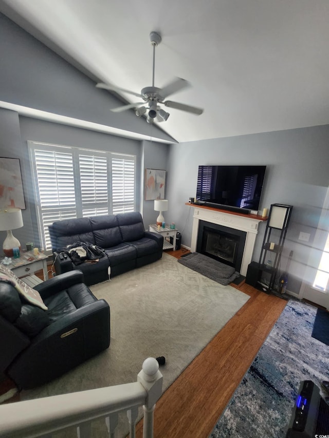 503 20th Ave N Unit 3B, North Myrtle Beach, SC 29582 - living area featuring wood finished floors, ceiling fan, a fireplace, and lofted ceiling
