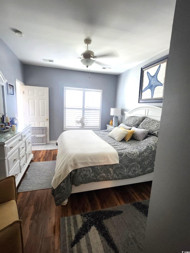 503 20th Ave N Unit 3B, North Myrtle Beach, SC 29582 - bedroom with dark wood-type flooring and a ceiling fan