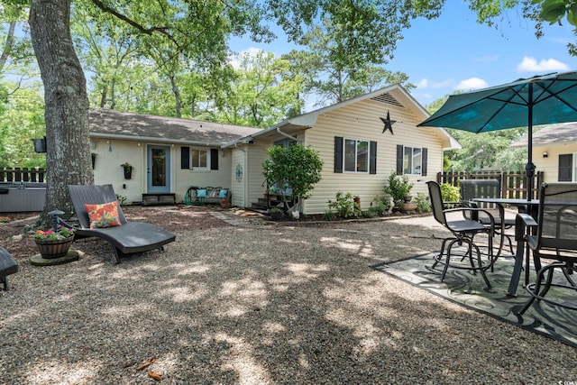 520 13th Ave N, Surfside Beach, SC 29575 - rear view of house featuring a patio area, roof with shingles, and outdoor dining space