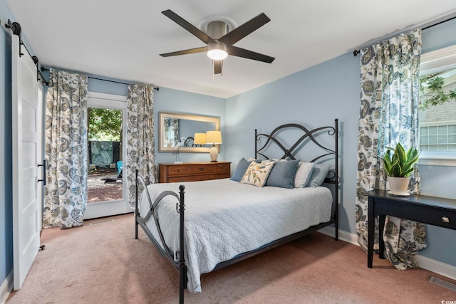 520 13th Ave N, Surfside Beach, SC 29575 - bedroom with carpet, a barn door, access to exterior, and ceiling fan