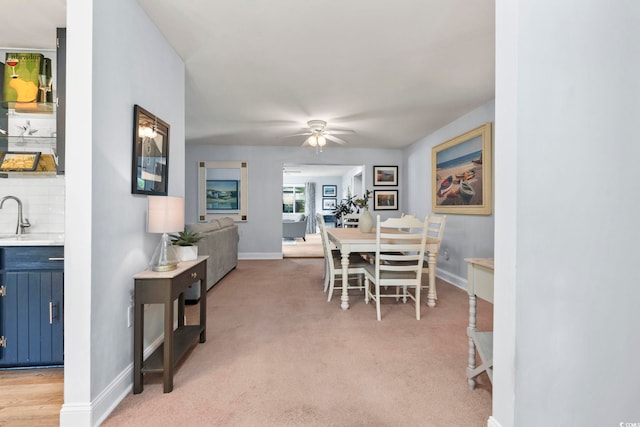 520 13th Ave N, Surfside Beach, SC 29575 - dining room with ceiling fan and light colored carpet