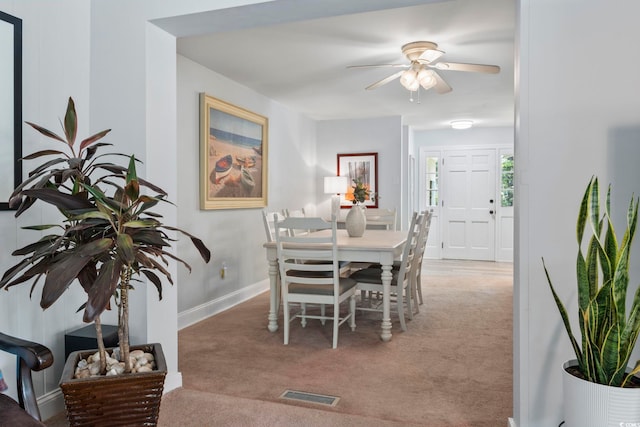520 13th Ave N, Surfside Beach, SC 29575 - dining area with light carpet and ceiling fan