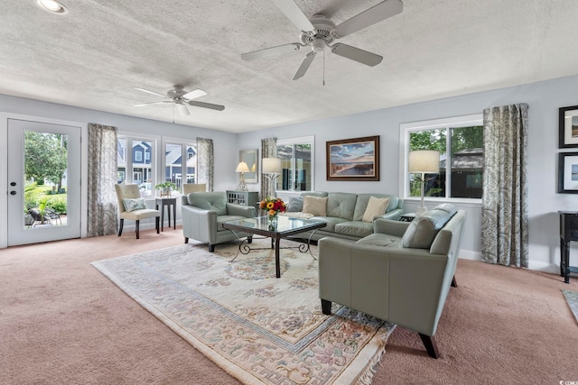520 13th Ave N, Surfside Beach, SC 29575 - carpeted living room with a textured ceiling and ceiling fan